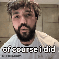 A Man With A Beard Is Wearing A White Shirt And Says Of Course I Did GIF
