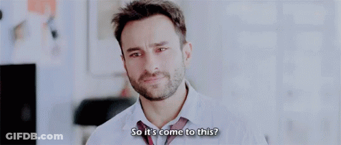A Man With A Beard Is Wearing A White Shirt And Tie . GIF