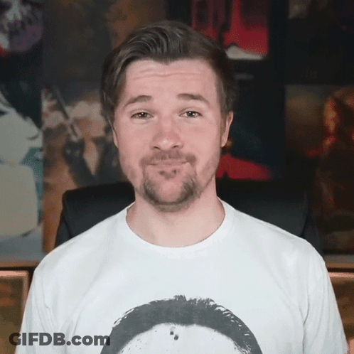 A Man With A Beard Is Wearing A White Shirt GIF