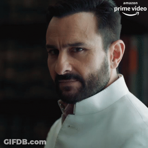 A Man With A Beard Is Wearing A White Shirt That Says Amazon Prime Video On The Bottom GIF