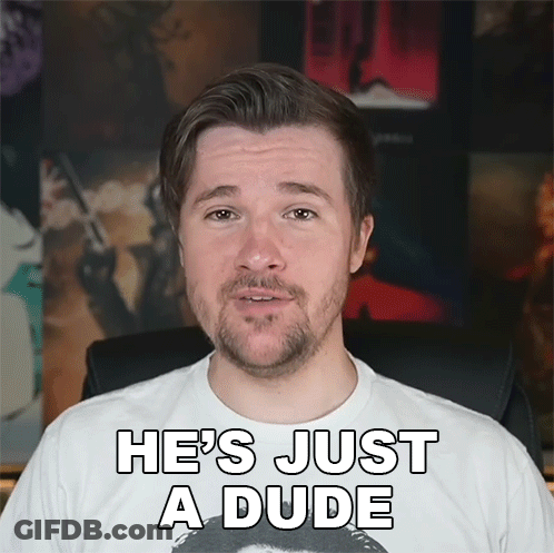 A Man With A Beard Is Wearing A White Shirt That Says He 'S Just A Dude On It GIF