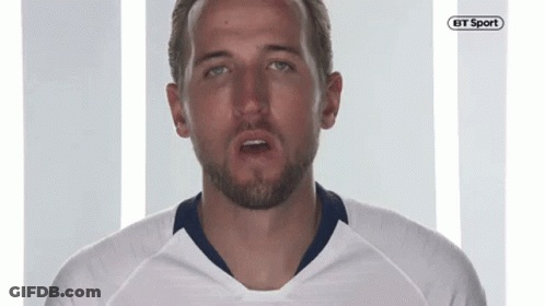A Man With A Beard Is Wearing A White Shirt With A Bt Sport Logo On It GIF