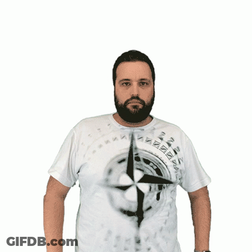 A Man With A Beard Is Wearing A White Shirt With A Picture Of A Compass On It GIF