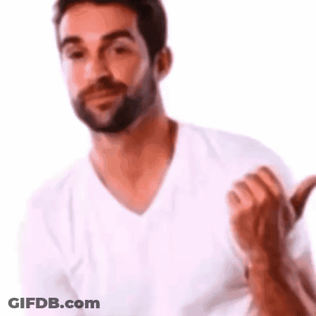 A Man With A Beard Is Wearing A White T-Shirt And Giving A Thumbs Up . GIF