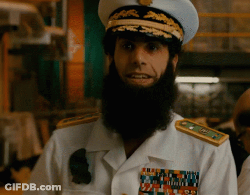 Bearded Man In White Uniform With Gold Shoulder Badges GIF