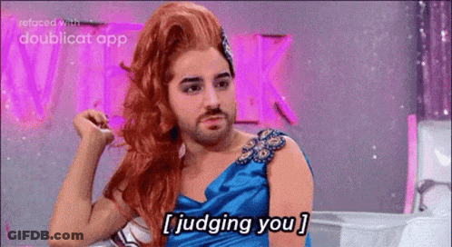 A Man With A Beard Is Wearing A Wig And A Blue Dress And Saying I Judging You . GIF