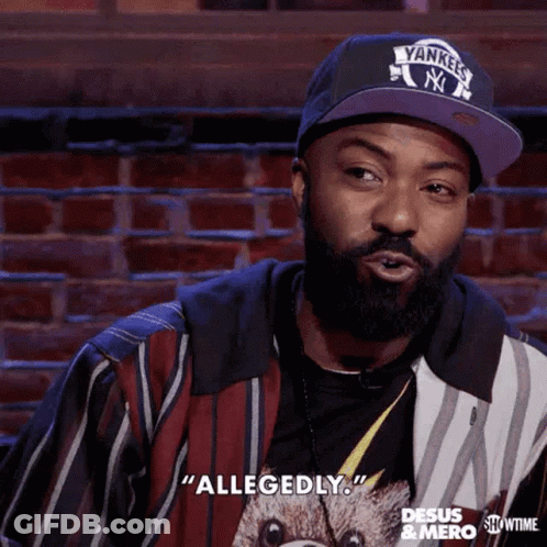 A Man With A Beard Is Wearing A Yankees Hat And Says Allegedly GIF