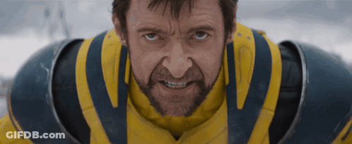 A Man With A Beard Is Wearing A Yellow And Blue Armor GIF