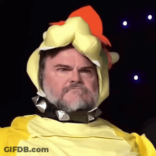 A Man With A Beard Is Wearing A Yellow And Orange Chicken Costume GIF