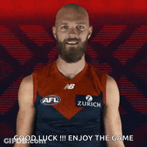 A Man With A Beard Is Wearing An Afl Jersey And Says Good Luck !!! Enjoy The Game . GIF
