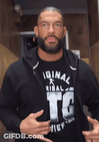A Man With A Beard Is Wearing An Original Tribal Otc Chief Shirt GIF