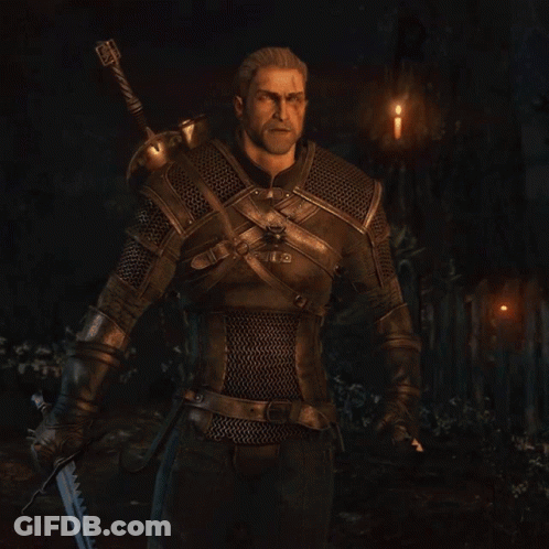 A Man With A Beard Is Wearing Chain Mail And A Sword GIF