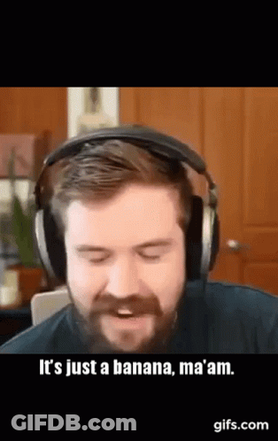 A Man With A Beard Is Wearing Headphones And Saying It 'S Just A Banana , Ma Am . GIF