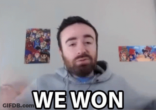 A Man With A Beard Is Wearing Headphones And Says `` We Won '' While Looking At The Camera . GIF