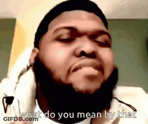 A Man With A Beard Is Wearing Headphones And Says " What Do You Mean By That " GIF
