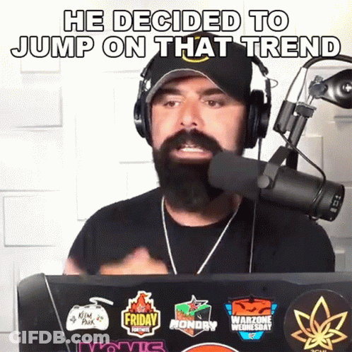 A Man With A Beard Is Wearing Headphones And Talking Into A Microphone With The Words He Decided To Jump On That Trend GIF