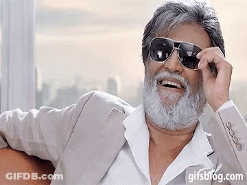 A Man With A Beard Is Wearing Sunglasses And A Gifsblog.com Watermark GIF