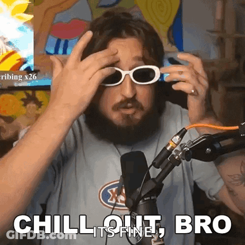 A Man With A Beard Is Wearing Sunglasses In Front Of A Microphone And Says Chill Out Bro GIF