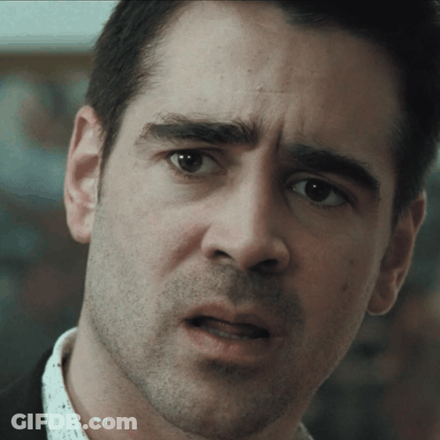 A Man With A Beard Looks At The Camera With A Serious Look On His Face GIF