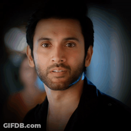 Serious Man With Beard Looking At Camera GIF