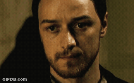 A Man With A Beard Looks At The Camera With His Eyes Closed GIF