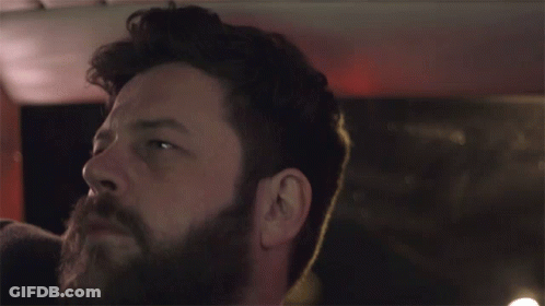 Man With Beard Looking Up In Darkness GIF