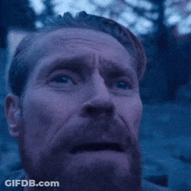 A Man With A Beard Looks Up At The Sky With His Eyes Closed GIF
