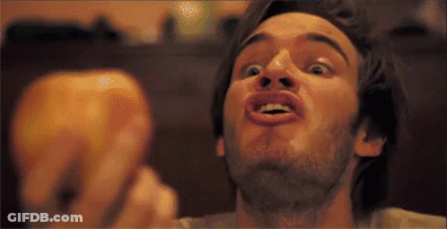 A Man With A Beard Making A Funny Face With His Mouth Open GIF