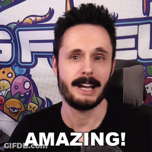 Man With Beard Saying Amazing In Front Of Graffiti GIF