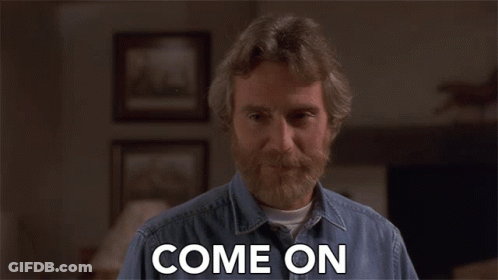 A Man With A Beard Says Come On In A Living Room GIF