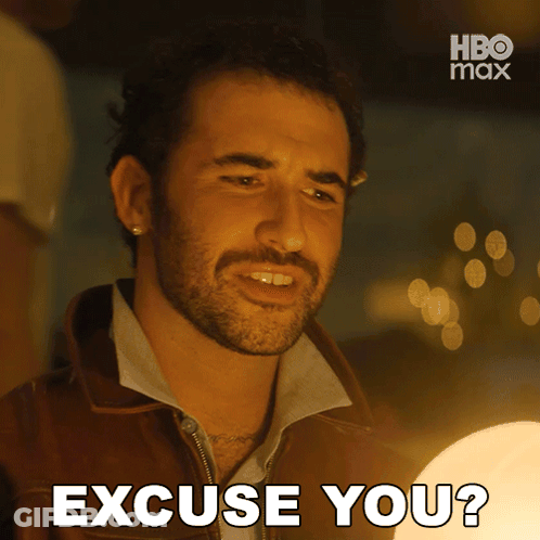 A Man With A Beard Says Excuse You In Front Of A Hbo Max Logo GIF
