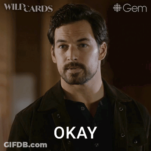 A Man With A Beard Says Fair Enough On A Poster GIF