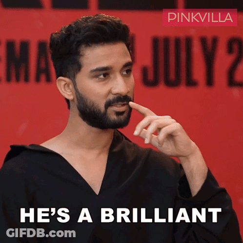 A Man With A Beard Says He 'S A Brilliant On A Red Background GIF