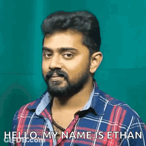A Man With A Beard Says Hello My Name Is Ethan In Front Of A Green Background GIF