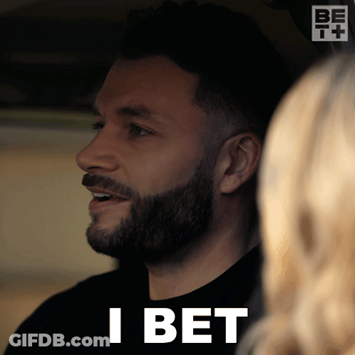 A Man With A Beard Says I Bet In Front Of A Woman GIF
