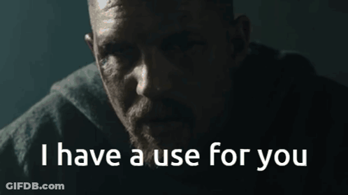 A Man With A Beard Says " I Have A Use For You " In A Dark Room GIF