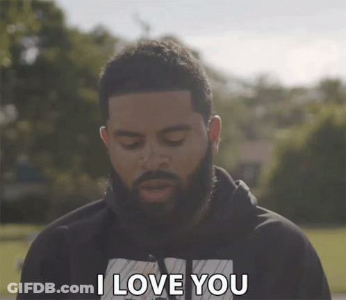 A Man With A Beard Says " I Love You " With His Eyes Closed GIF