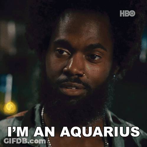 A Man With A Beard Says " I 'M An Aquarius " In Front Of A Hbo Logo GIF