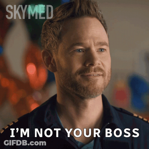 A Man With A Beard Says " I 'M Not Your Boss " In Front Of Balloons GIF