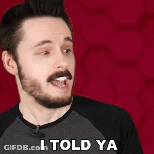 A Man With A Beard Says I Told Ya In Front Of A Red Background GIF