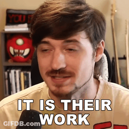 A Man With A Beard Says It Is Their Work In Front Of A Microphone GIF