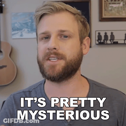 A Man With A Beard Says It 'S Pretty Mysterious In Front Of A Guitar GIF
