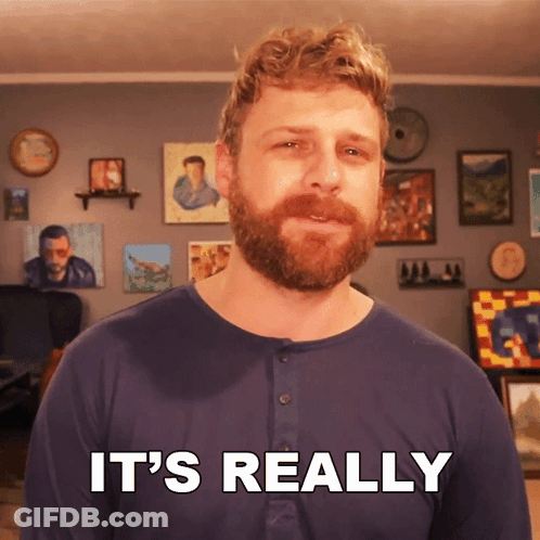A Man With A Beard Says It 'S Really In Front Of A Wall Of Paintings GIF