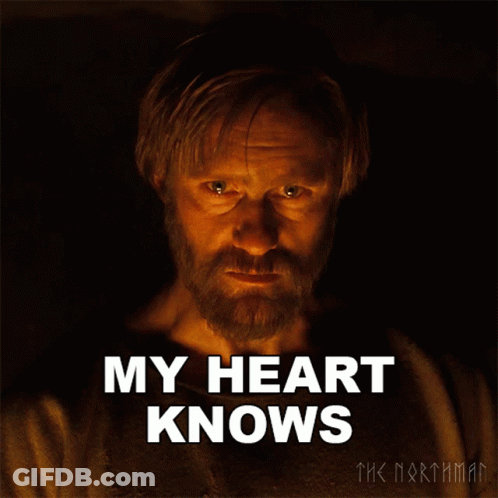 A Man With A Beard Says " My Heart Knows " In Front Of Him GIF