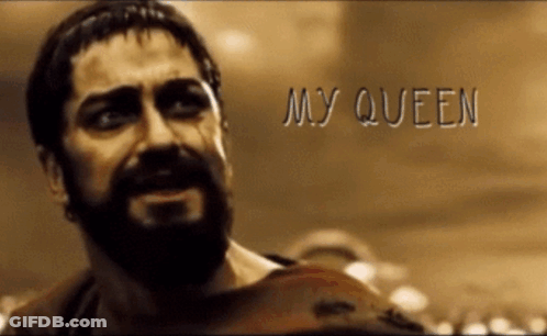 A Man With A Beard Says My Queen In Front Of A Crowd Of People GIF
