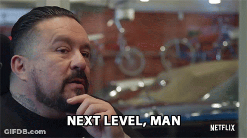 A Man With A Beard Says Next Level Man In Front Of A Window GIF