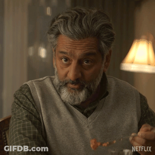A Man With A Beard Says Please Tell Us More In A Netflix Ad GIF