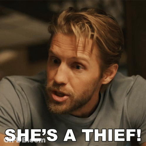 A Man With A Beard Says She 'S A Thief In White Letters GIF