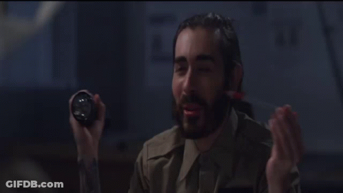 A Man With A Beard Says Shut It Down In A Dark Room GIF