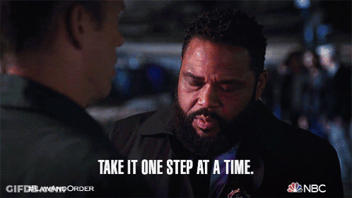 A Man With A Beard Says Take It One Step At A Time While Talking To Another Man GIF